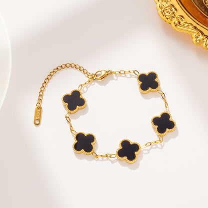 Elegant Black and White Four-Leaf Clover Bracelet